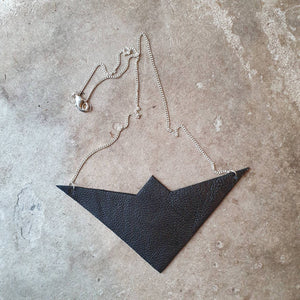 Leather paper aeroplane bib necklace