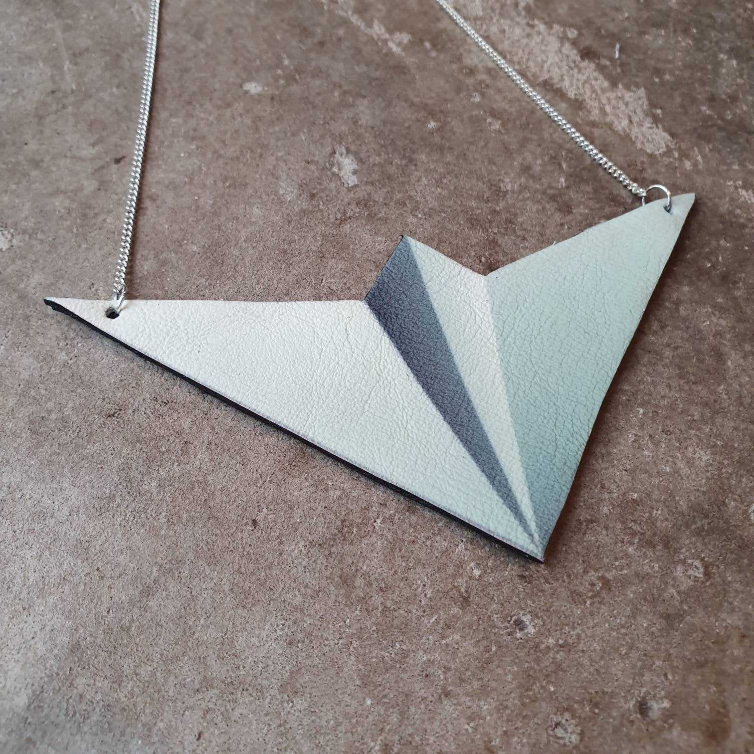 Leather paper aeroplane bib necklace